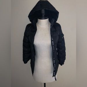 Kids Justice black puffer jacket with hood. Size 10